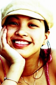 Photo of a teenage girl, smiling and ready to share information.