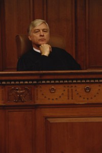 Photo of a judge sitting behind the bench.