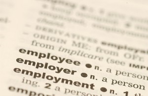A closeup of dictionary listings for employee, employer, and employment.