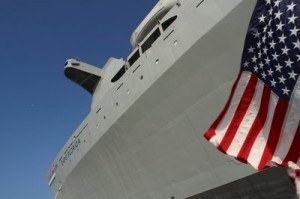 Closeup view of a Navy vessel with the US flag flying high.