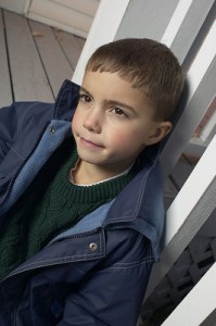 Close-up photo of a serious-faced boy about 10 years old.
