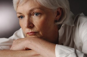 Closeup of a woman looking worried.