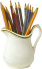 a pitcher with lots of pencils and pens inside