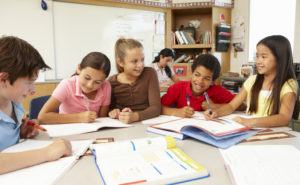 Teacher and schoolchildren in class