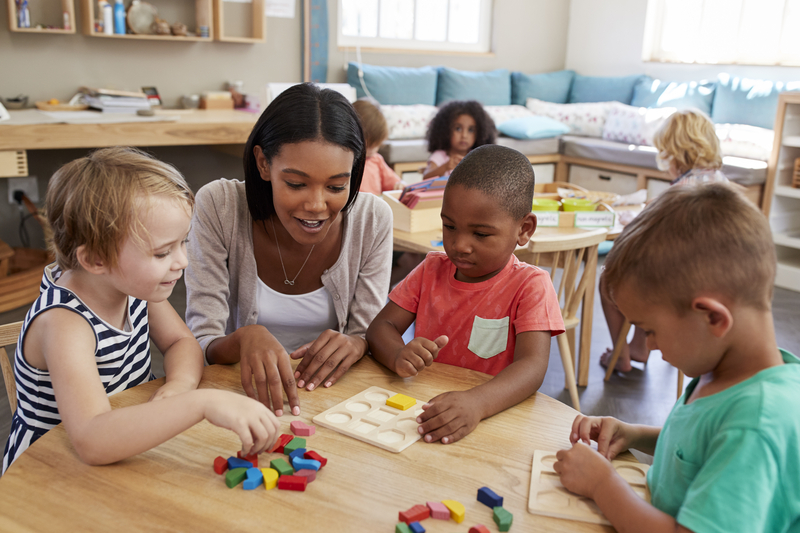 preschool Preschoolers stacking and sorting blocks