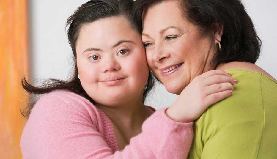 Daughter with down syndrome hugs her mother