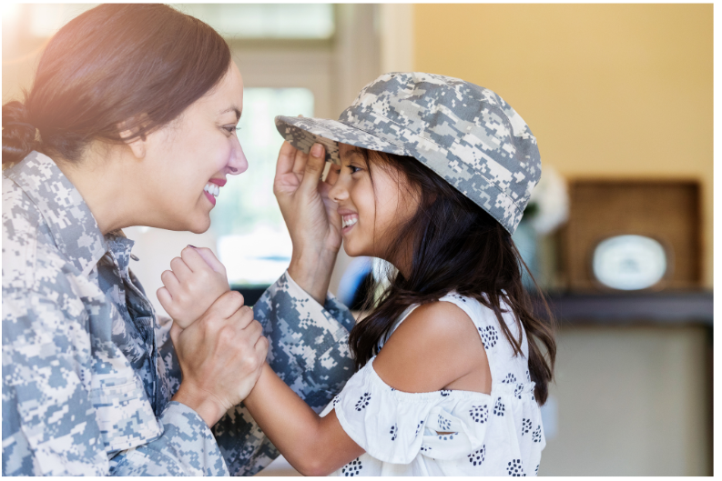 Military Family Mom in the military with daughter wearing military hat.