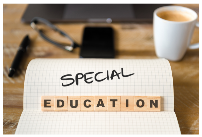sped (1) Paper on desk with Special Education written on it.