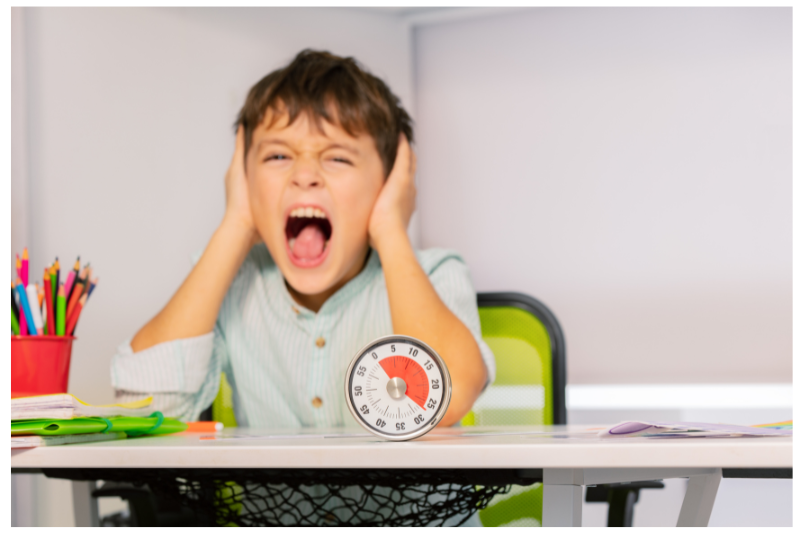 Child covering his ears and screaming.