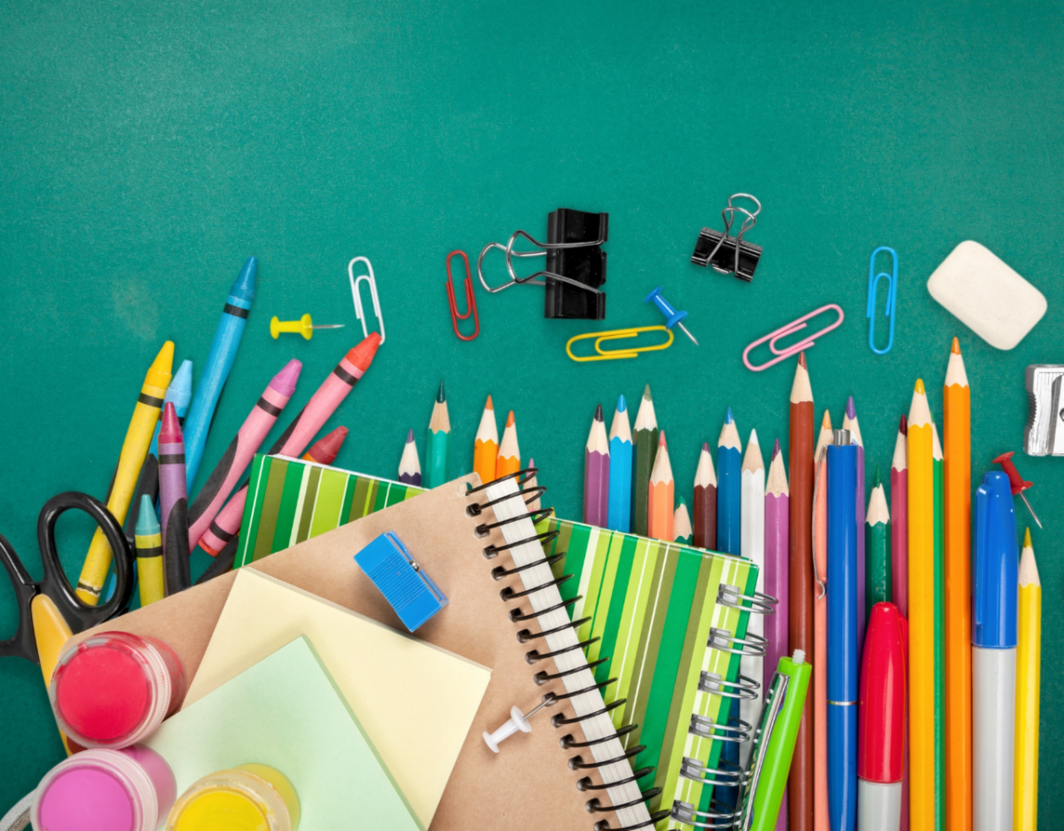Picture of notebooks, pencils, and crayons.
